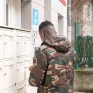 Résidence sociale St Bruno - un jeune résident ouvre sa boîte aux lettres